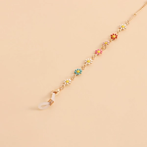 Detail of gold eyewear chain featuring multi-color daisy charms and silicone loops