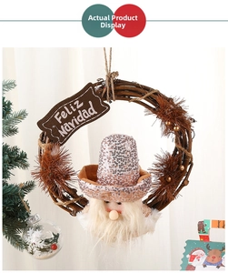 Close-up of Christmas wreath with Santa gnome and Feliz Navidad wooden sign