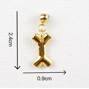 Detailed size specifications for the gold bone bow pendant measuring 2.4cm by 0.9cm