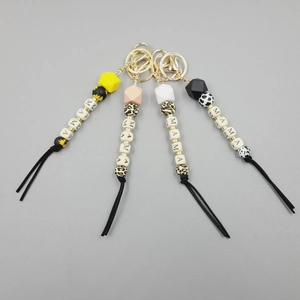Detail of MAMA letter bead keychain set with silicone beads and black soft tassels