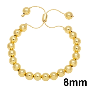 8mm gold beaded bracelet with adjustable slider clasp on minimalist white background