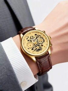 Close-up of WOKAI men's chronograph watch with gold case on wrist in business attire