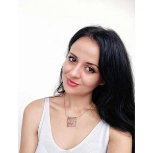 Close-up of square city map cutout necklace in rose gold finish on model