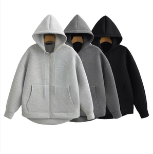 Unisex oversized zip-up hoodies in black and grey shades featuring large front pockets