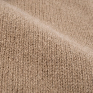 Premium merino wool knitted beanie in camel brown with soft ribbed texture for winter warmth