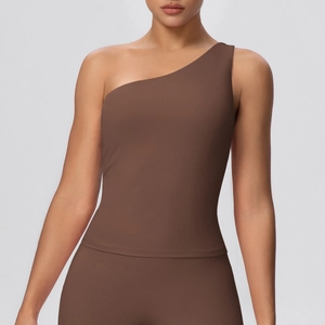 Detailed view of brown one-shoulder yoga top with high-stretch seamless knitted fabric