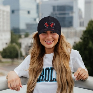 Black washed cotton baseball cap with red butterfly embroidery and Free flight text detail