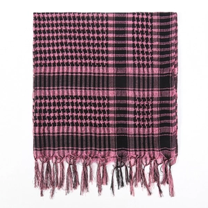 Detail of pink and black shemagh scarf featuring geometric patterns and long tassels
