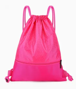 Close-up of pink nylon drawstring bag featuring hexagonal honeycomb texture and zipper pocket