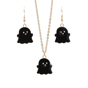 Detail of Halloween ghost jewelry set with black enamel pendants and golden chain