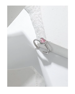 Close-up of heart-shaped pink zircon inlay and S925 silver engraving on open ring