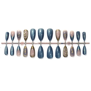 3D French cat-eye press-on nails with blue gems and gold rose embossing details