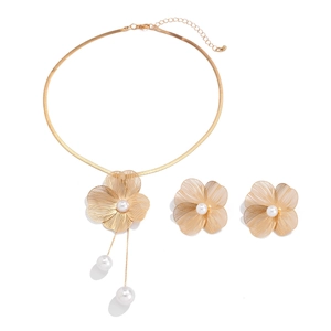 Golden flower jewelry set with white pearls including necklace and matching earrings