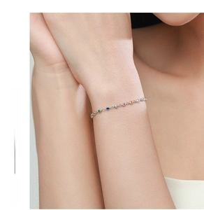 Detailed close-up of a delicate S925 silver bracelet featuring colorful zircon stones