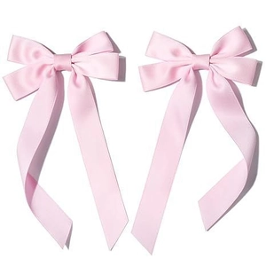Detail of two pink satin ribbon bow hairpins showing silk-like texture and soft sheen