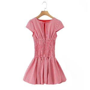 Detail view of red plaid dress back with hollow lace-up design and elastic smocked waist