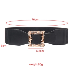 Detail of a black elastic waist belt with a crystal square buckle and size measurements