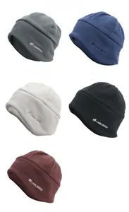 Detailed flat lay of fleece thermal hats in various colors with printed logo detail