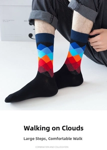Detail of men's crew socks featuring colorful argyle patterns on black combed cotton