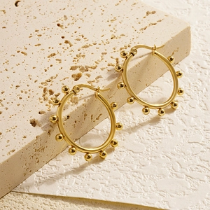 Golden titanium steel beaded hoop earrings for women with minimalist retro metal design