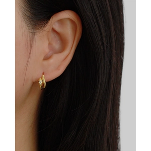 Elegant gold snake hoop earrings with zircon stone details for a minimalist luxury look