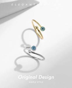 Detail of S925 silver adjustable ring featuring a blue turquoise evil eye design