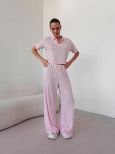 Women's pink knitted two-piece set featuring short sleeve polo top and wide leg pants