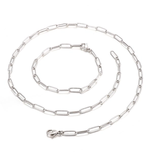 Minimalist silver paperclip chain necklace and bracelet jewelry set on white background
