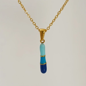 Gold pendant necklace featuring a blue gradient enamel pillar design with letter detail