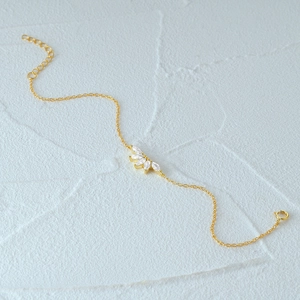 Macro detail of S925 sterling silver crown bracelet with marquise-cut cubic zirconia
