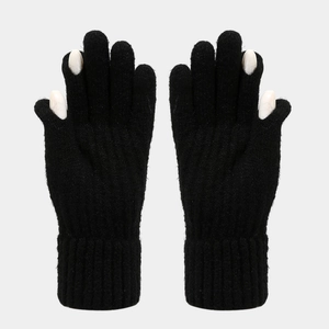 Close-up of black knit touchscreen gloves with ribbed cuffs and thick wool texture