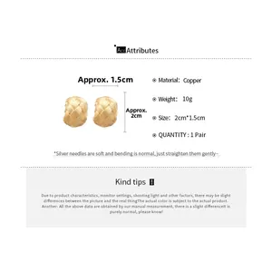 Detail view of gold woven texture C-shaped earrings with size and material specifications
