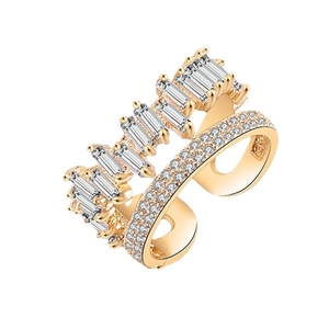 Double-layered gold crossover ring featuring pavé zircons and baguette-cut stones