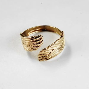 Vintage golden wing-shaped stainless steel open ring with intricate geometric textured lines