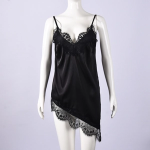 Close-up of black satin camisole with delicate eyelash lace trim and irregular hemline