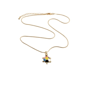 Detailed view of turtle pendant necklace with colorful enamel inlay on gold chain