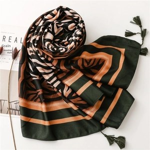 Boho zebra print silk scarf with tassels in deep green and orange for beach sun protection