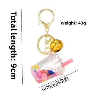 Detailed view of pink bubble tea keychain with dimensions 9cm total length and 6cm height
