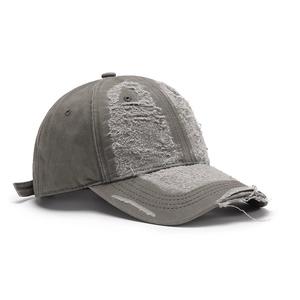 Washed dark gray distressed cotton baseball cap with vintage frayed edges and torn details