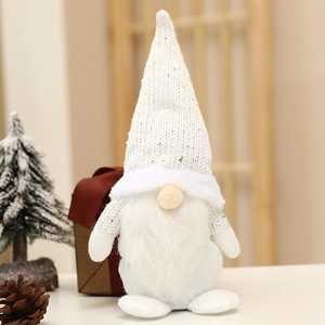 Close-up of a white sequined Christmas gnome with long white beard and Nordic holiday decor