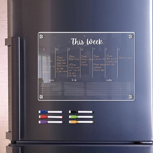 Magnetic acrylic weekly calendar board with dry-erase markers on a refrigerator