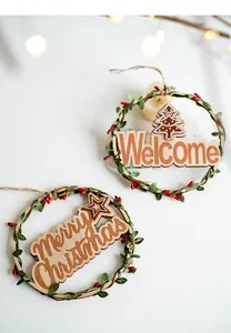 Detail of wooden Christmas wreath with Merry Christmas lettering and pine decorations
