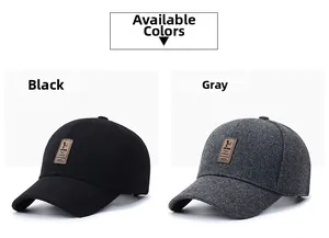 Detail view of winter baseball caps in black and grey with ear protection and leather patch