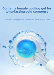 Close-up of stainless steel ice globe massager with blue cooling liquid and water splashes