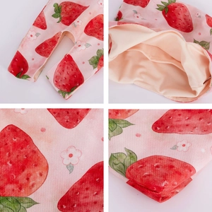 Detail of pink strawberry print fabric with breathable beige mesh lining for baby pouch