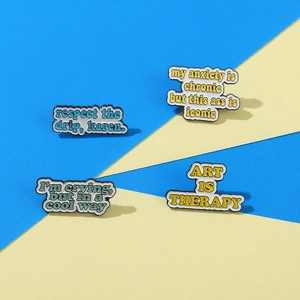 Art Is Therapy enamel pin set featuring four colorful creative message metal badges
