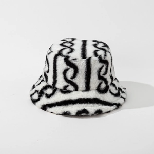Close-up of black and white striped faux fur texture on the winter bucket hat fabric