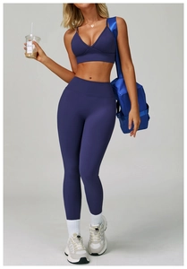 Dark purple high-waisted seamless yoga set featuring U-neck sports bra and leggings