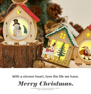 Three wooden LED Christmas house ornaments with snowman, deer and Santa cutout designs