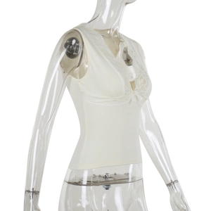 Detailed side view of off-white lace trim V-neck camisole top on transparent mannequin